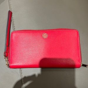 Slightly used authentic red outside dark navy blue inside Tory Burch wallet
